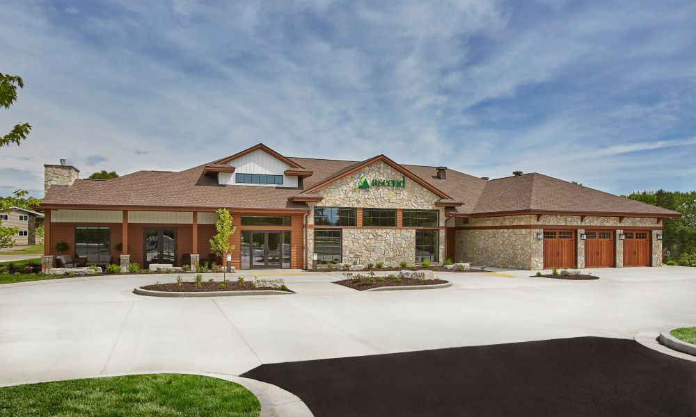 A large house with a driveway in front of it