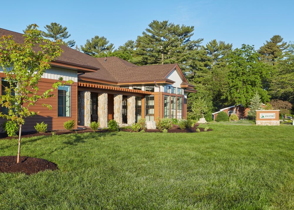 A large house with a large lawn in front of it