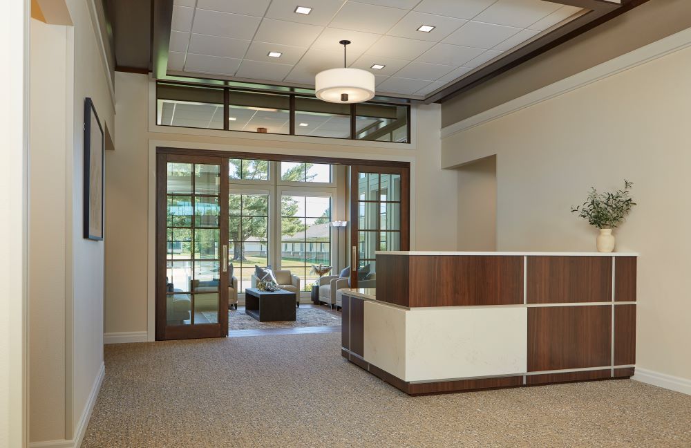 There is a reception desk in the middle of the room.