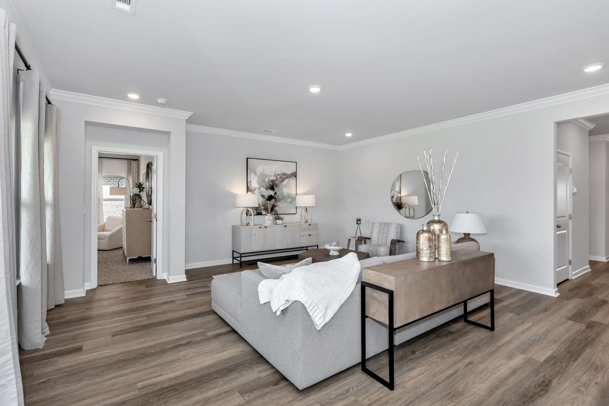 Living room with gray walls, wood floors, and modern furniture.