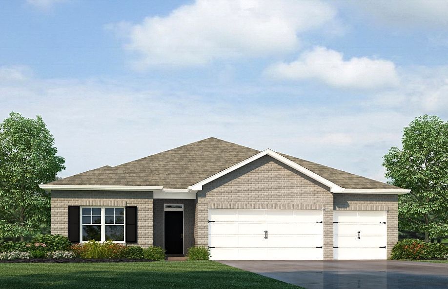 Single-story brick house with two-car garage, blue sky, and trees.