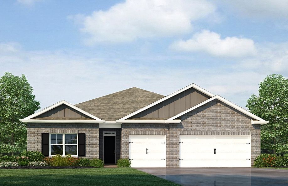 A brick house with a brown roof and two-car garage on a sunny day.