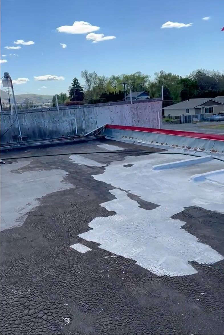 Roof layers being removed at Naches Fruit Stand in Naches, WA.
