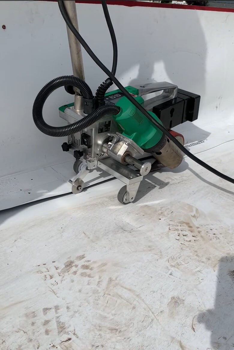 Sealing wall Flashing with the walk-behind, Naches Fruit Stand early spring of 2024