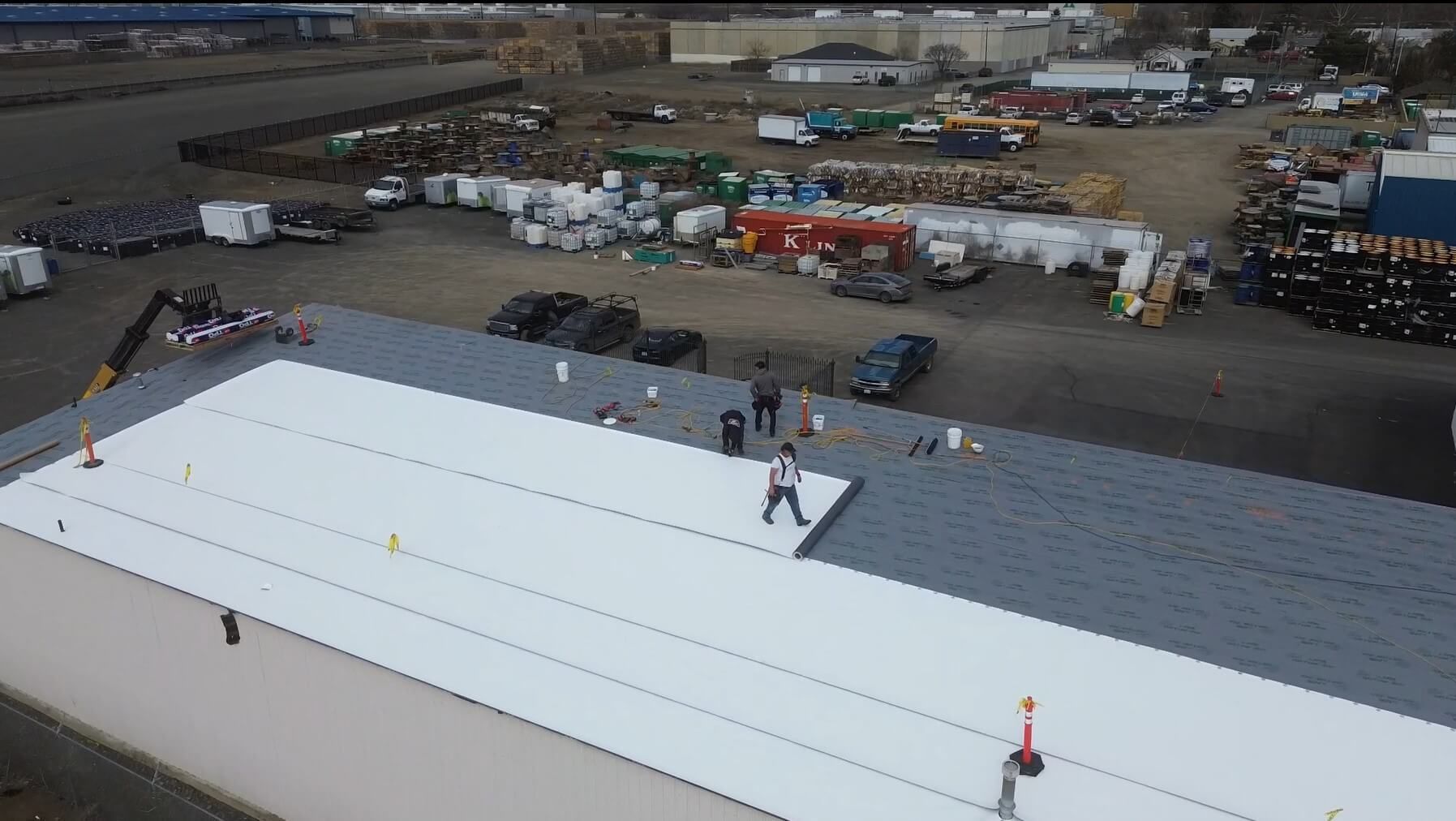 Aerial shot of TPO membrane installation on OSB sheeting at Decco USA roof in Yakima.