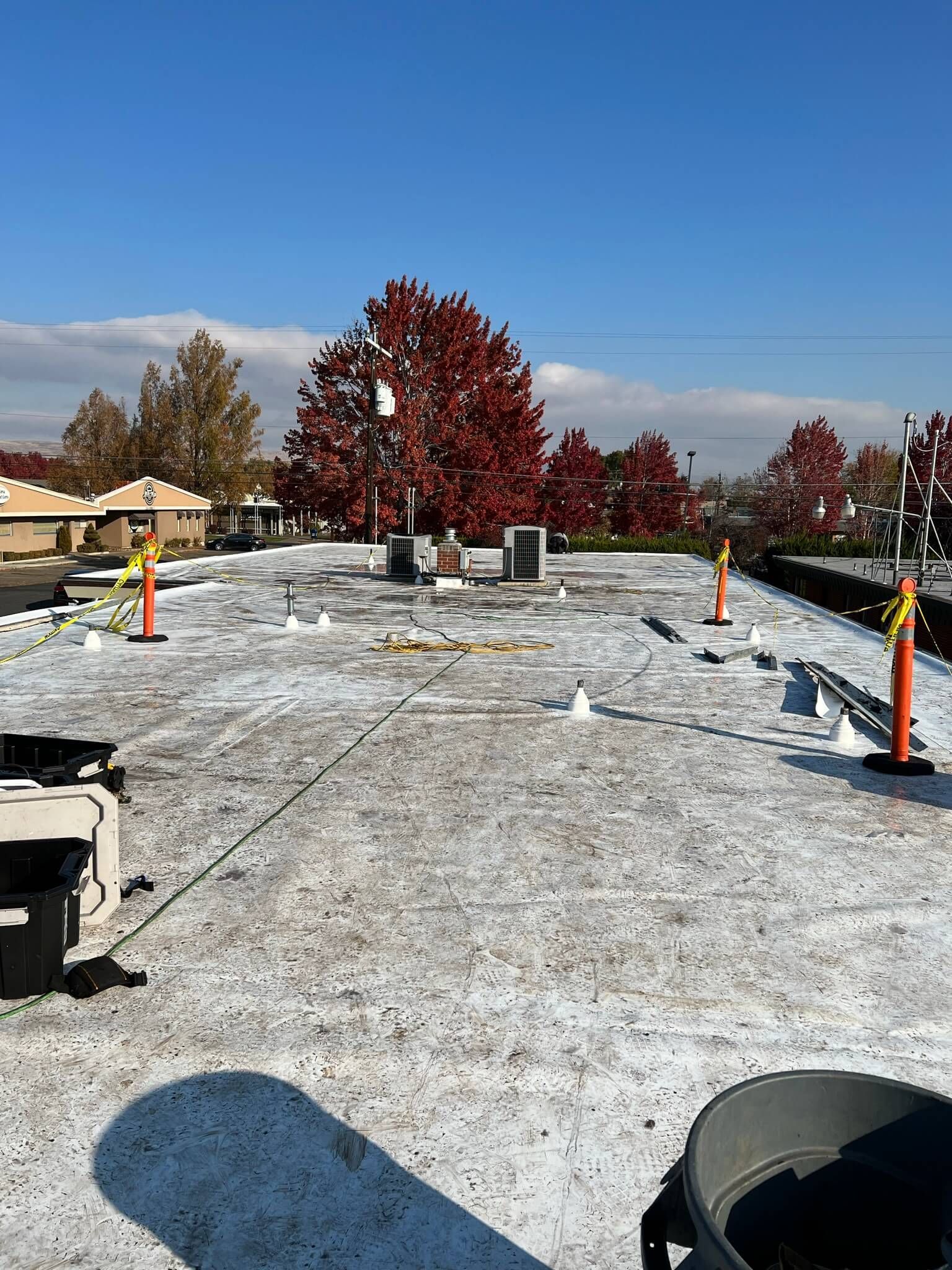 Roof surface preparation at Labcorp Yakima showing with materials and tools in place for TPO installation.
