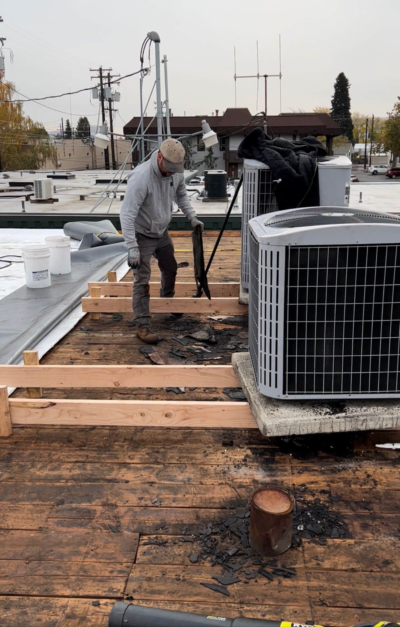 Workers installing a 60 mil TPO membrane on the Labcorp Yakima roof, showcasing clean and professional application.