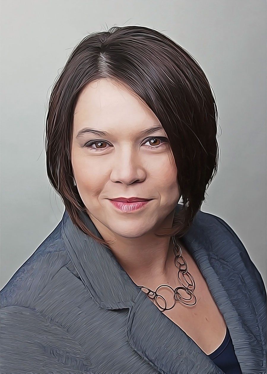 a woman wearing a suit and a necklace smiles for the camera