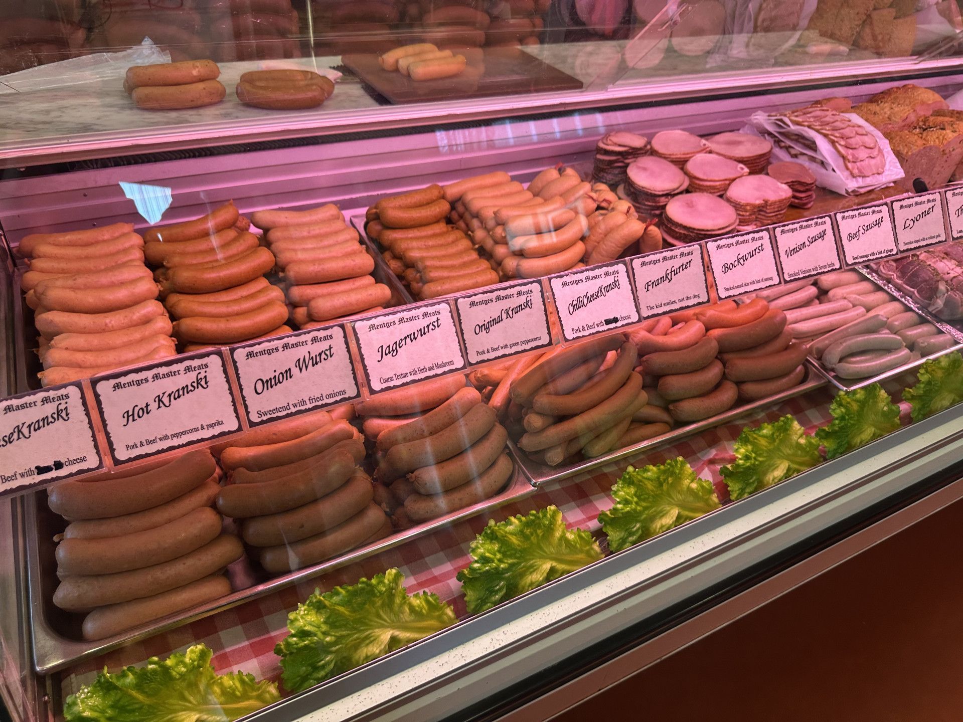 A Sandwich with Ham , Cheese and Bread on A Wooden Table —Mentges Master Meats Traditional Continental Smallgoods In Taree, NSW