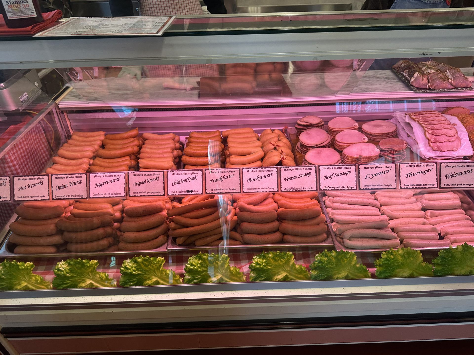 Grilled Sausages on A Wooden Cutting Board with Ketchup — Mentges Master Meats Traditional Continental Smallgoods In Taree, NSW