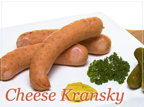 A White Plate Topped With Cheese Kransky Sausages and Pickles — Mentges Master Meats Traditional Continental Smallgoods In Taree, NSW