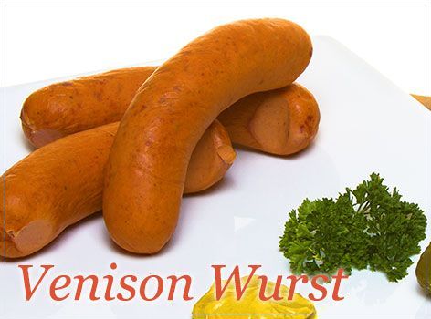 A White Plate Topped With Venison Wurst and Parsley — Mentges Master Meats Traditional Continental Smallgoods In Taree, NSW