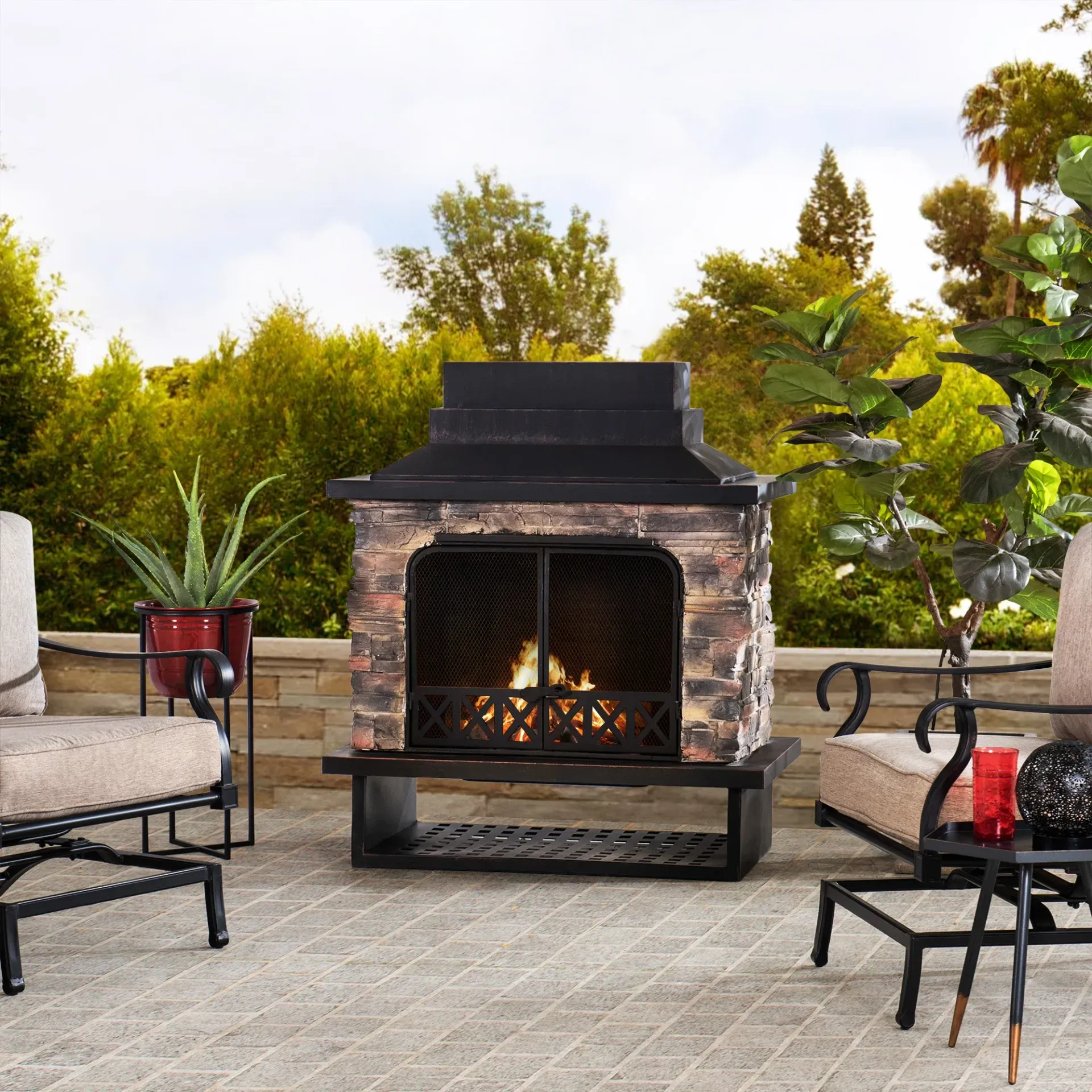 An inviting outdoor fireplace on a patio surrounded by comfortable seating.