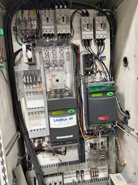 Electrical control panel with Sabana EP drives, circuit breakers, and wiring.