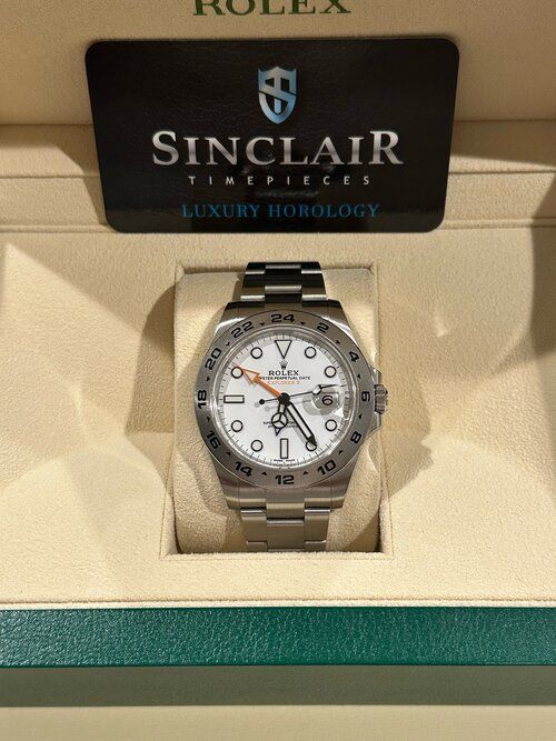 A rolex watch is in a sinclair box