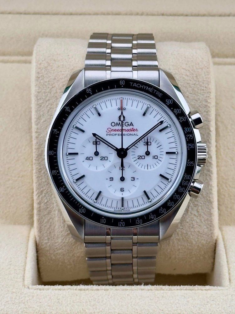 A silver omega watch with a white face