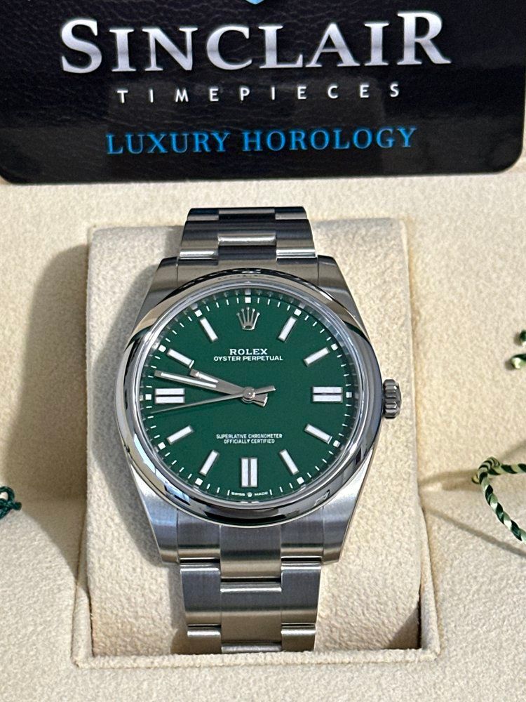 A sinclair timepieces luxury horology watch with a green face