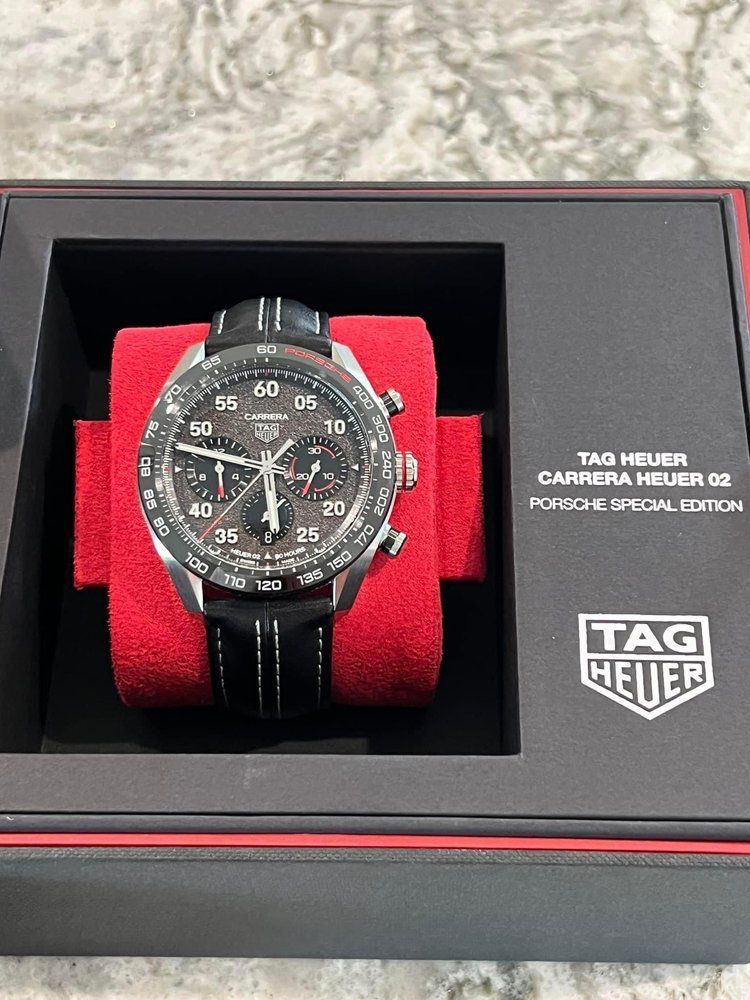 A tag heuer watch is in a black box