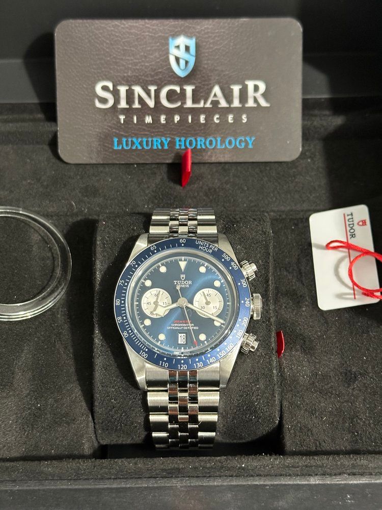 A sinclair timepiece is in a black box
