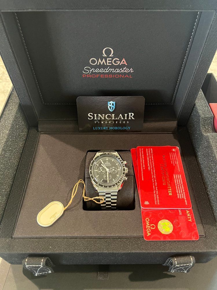 A omega watch is sitting inside of a black case.