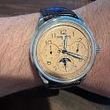 A person is wearing a watch on their wrist.