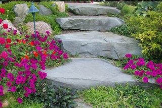 Beautiful Stone Stairway With Pink Flowers On Side — Landscaping in Shelby Township, MI