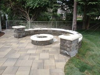 Rounded Fire Pit With Stone Curve Bench — Landscaping in Shelby Township, MI