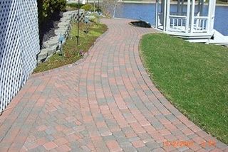 Orange Brick Walkway In Side Of River — Landscaping in Shelby Township, MI