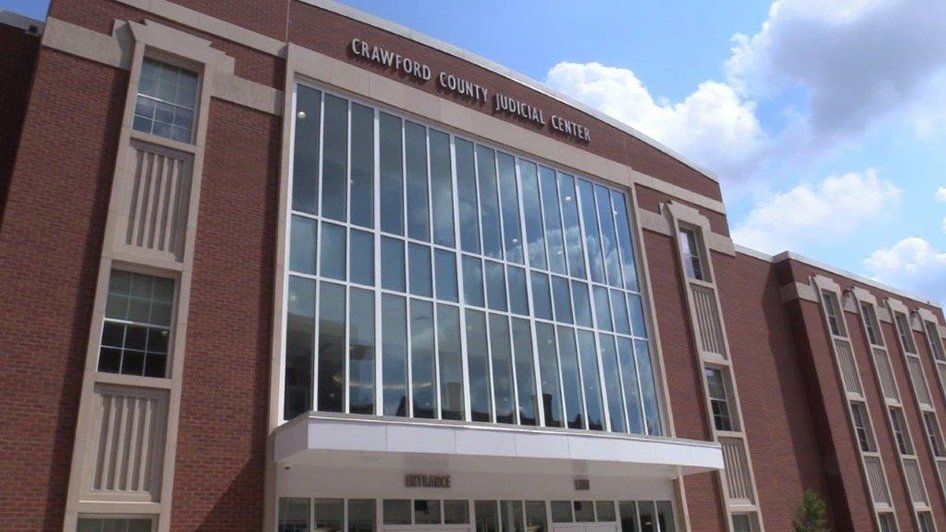 A large brick building with a lot of windows and the word county on it