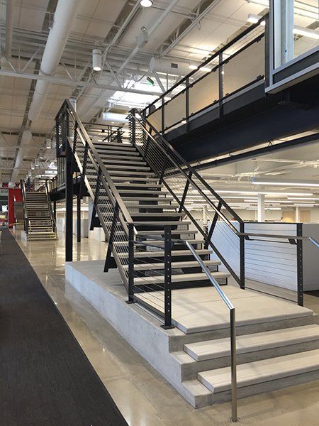 A set of stairs leading up to the second floor of a building