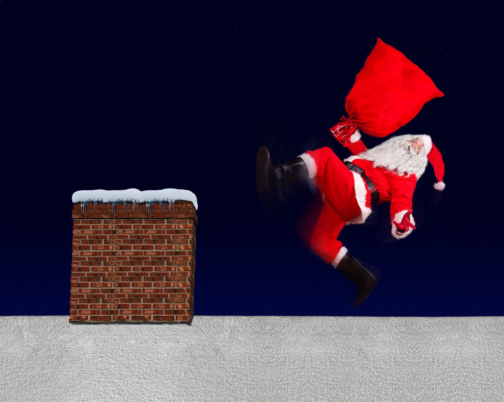 Santa Claus slipping on a snowy roof.