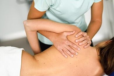 Chiropractor Melbourne | Physiotherapist Giving Shoulder Massage to a Woman | Melbourne, FL