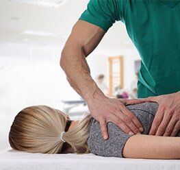 Woman Having Chiropractic Back Adjustment — Chiropractic Care in Brevard Country, FA