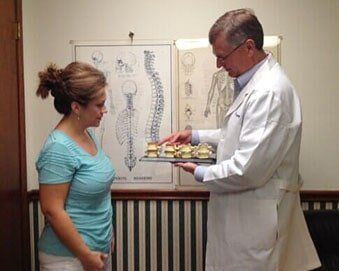 Doctor explaining injury—Shoulder Pain in Saraland, AL