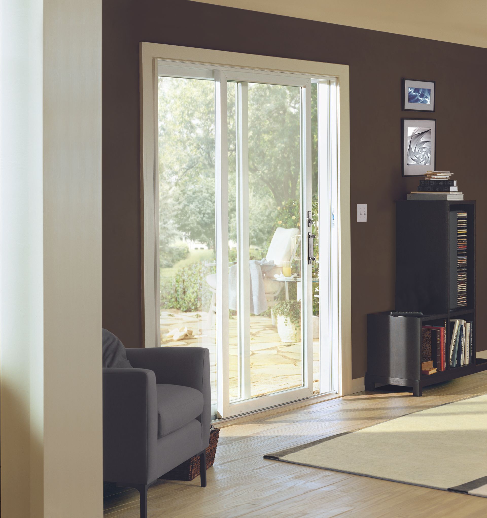 A living room with a lot of windows and furniture
