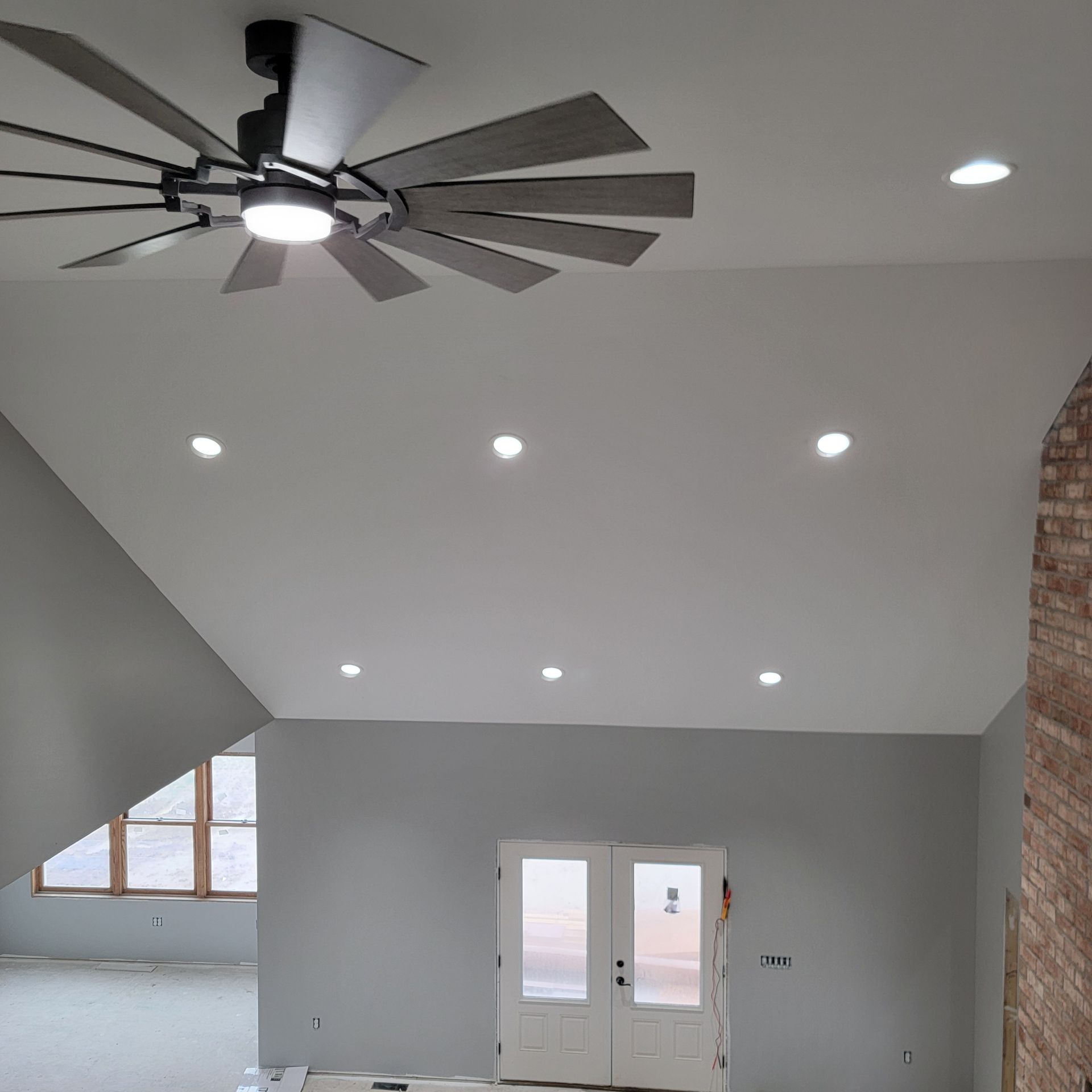 An electrician is cutting a wire — Harrington, DE — Tudor Electrical Services