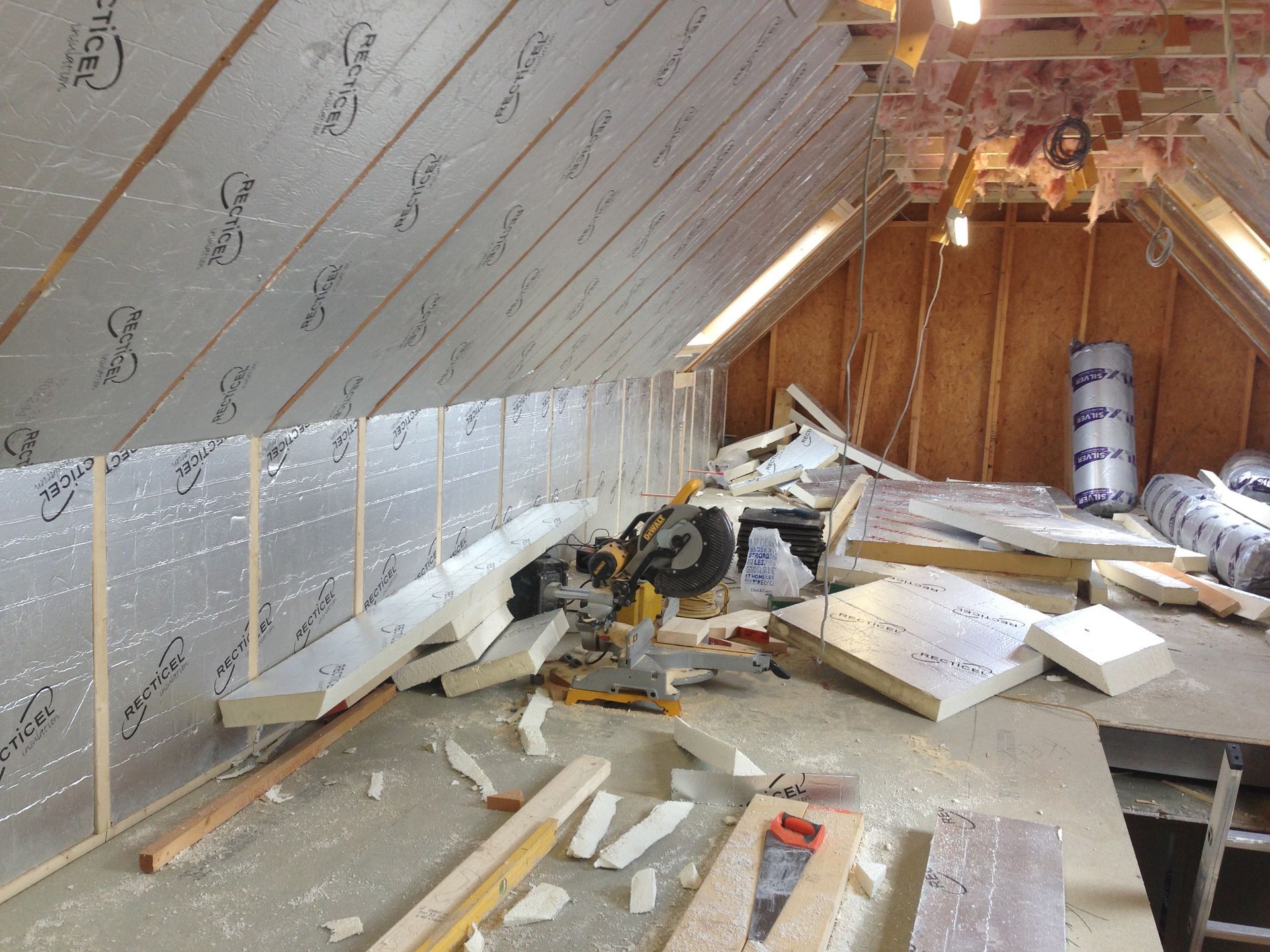 The attic is being remodeled and there is a lot of foam on the floor.