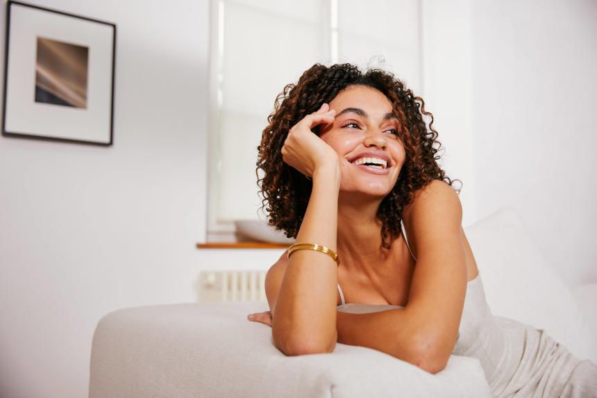 Smiling woman with curly hair