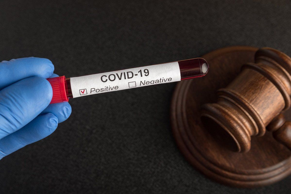 Blood Samples in Tube with Label COVID 19 and Judges Gavel — COVID Rights in Darwin, NT