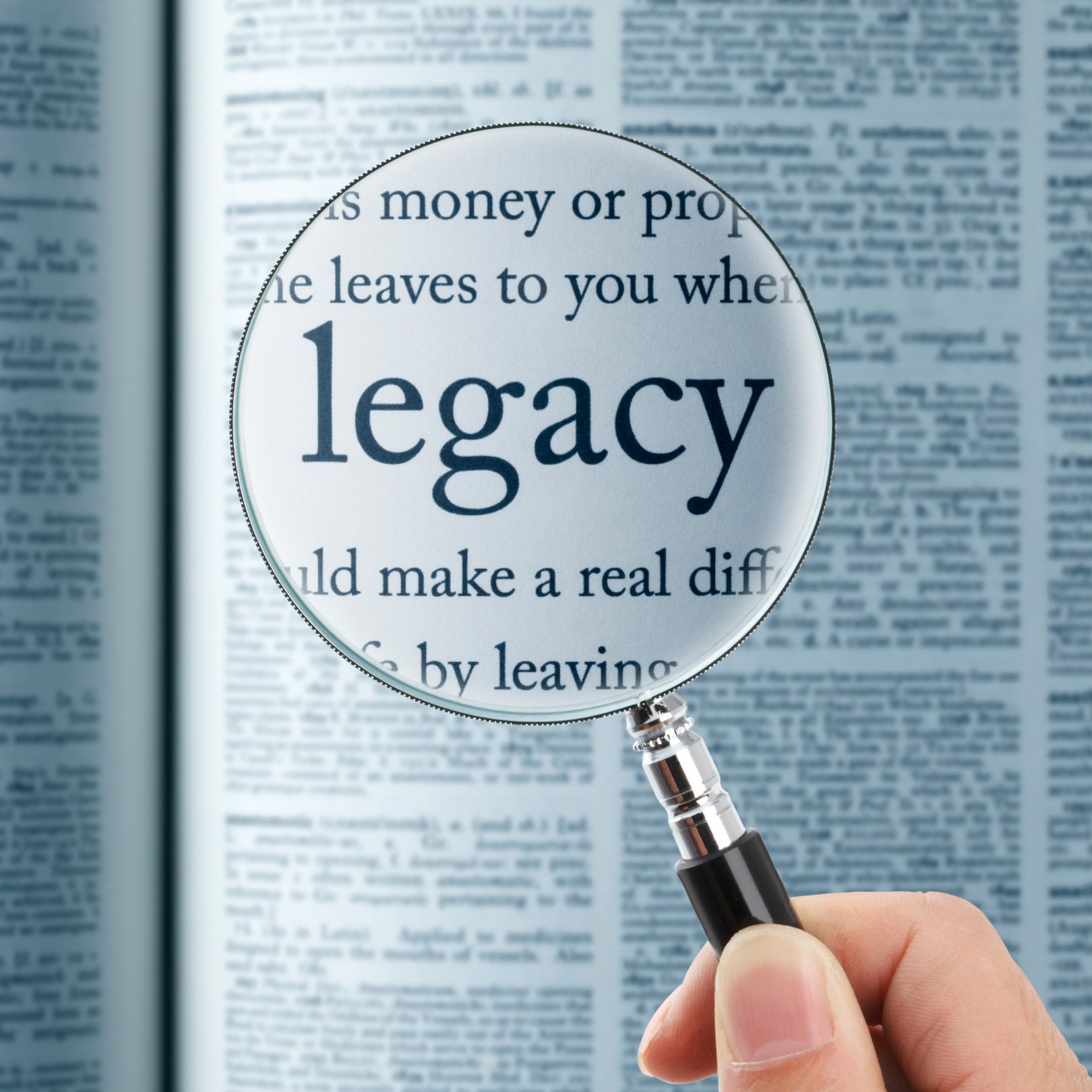 A magnifying glass with the word legacy on it