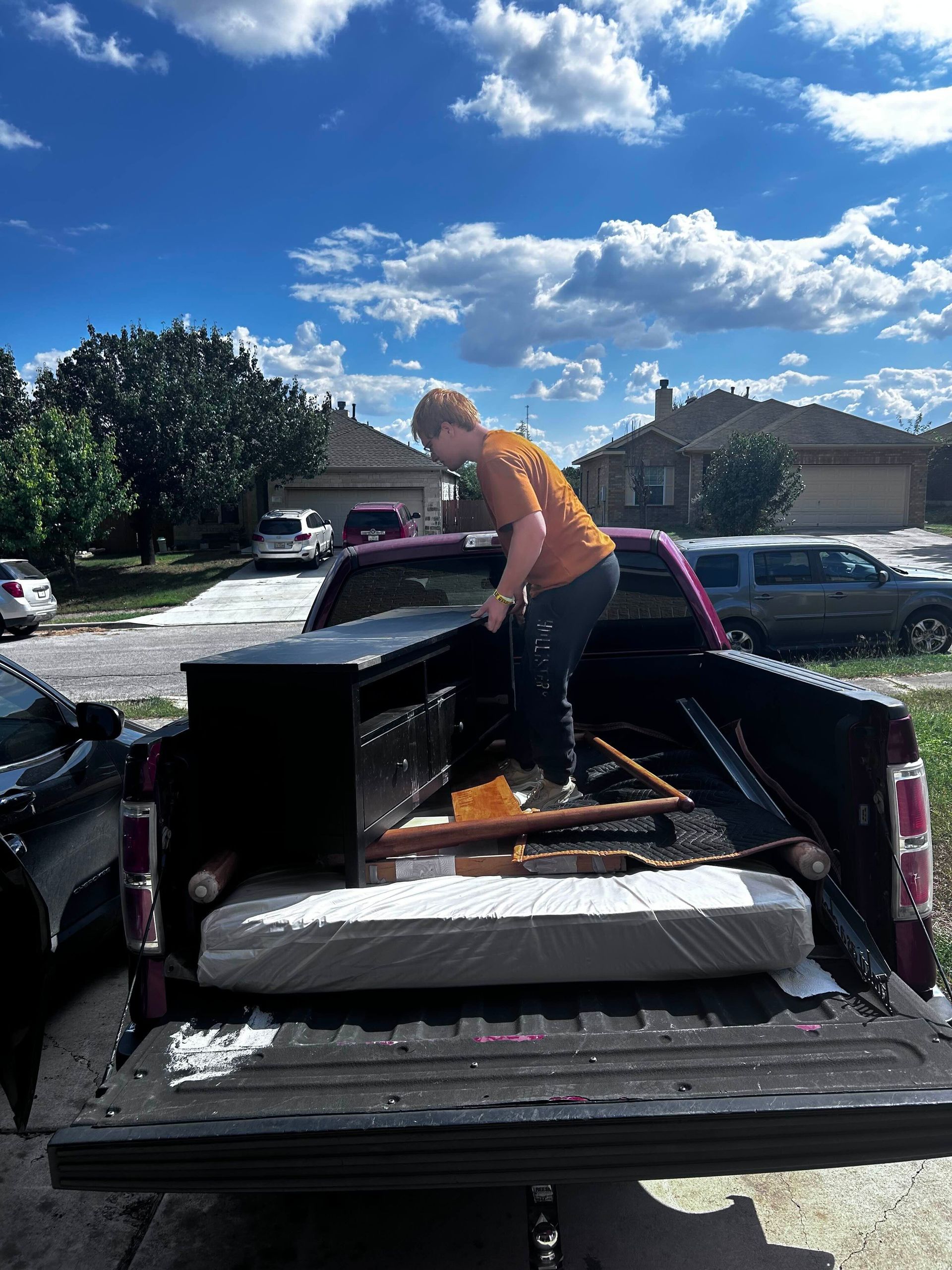 Jacked hauling staff loading a truck