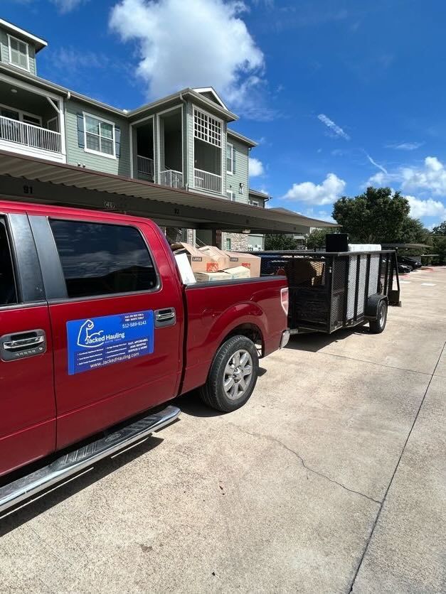 Jacked Hauling truck loaded with moving items
