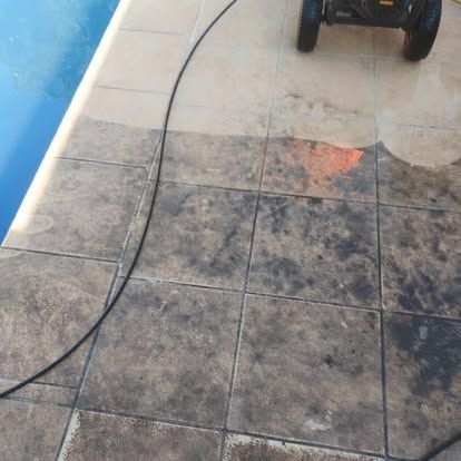 A Power Washer Is Cleaning A Tiled Floor Next To A Pool — Amaze Lawn and Garden Care In Nelson Bay, NSW