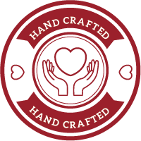 a hand crafted logo with two hands holding a heart in a circle .