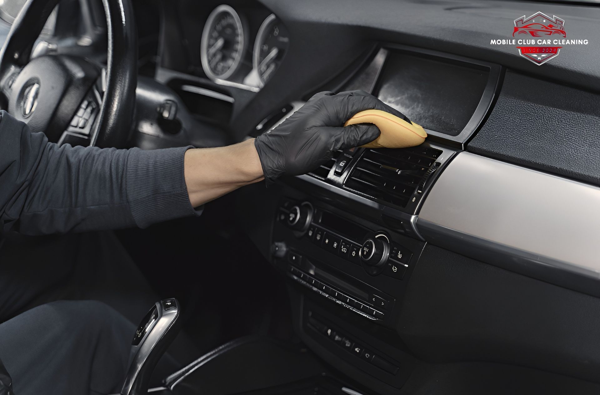 Gloved Hand Cleaning Car Dashboard — Mobile Club Car Cleaning in Earlville, QLD