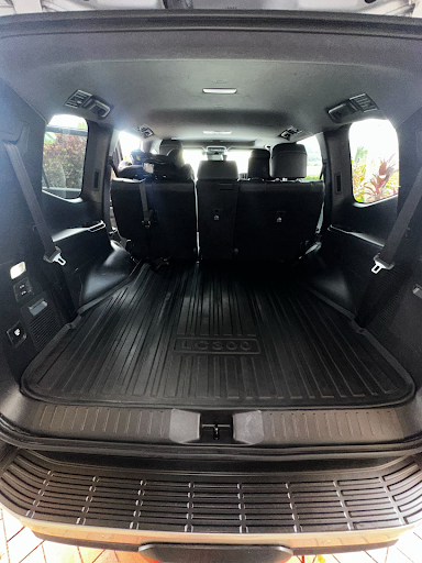 Interior of a Vehicle With Black Seats and a Cargo Mat — Mobile Club Car Cleaning in Earlville, QLD