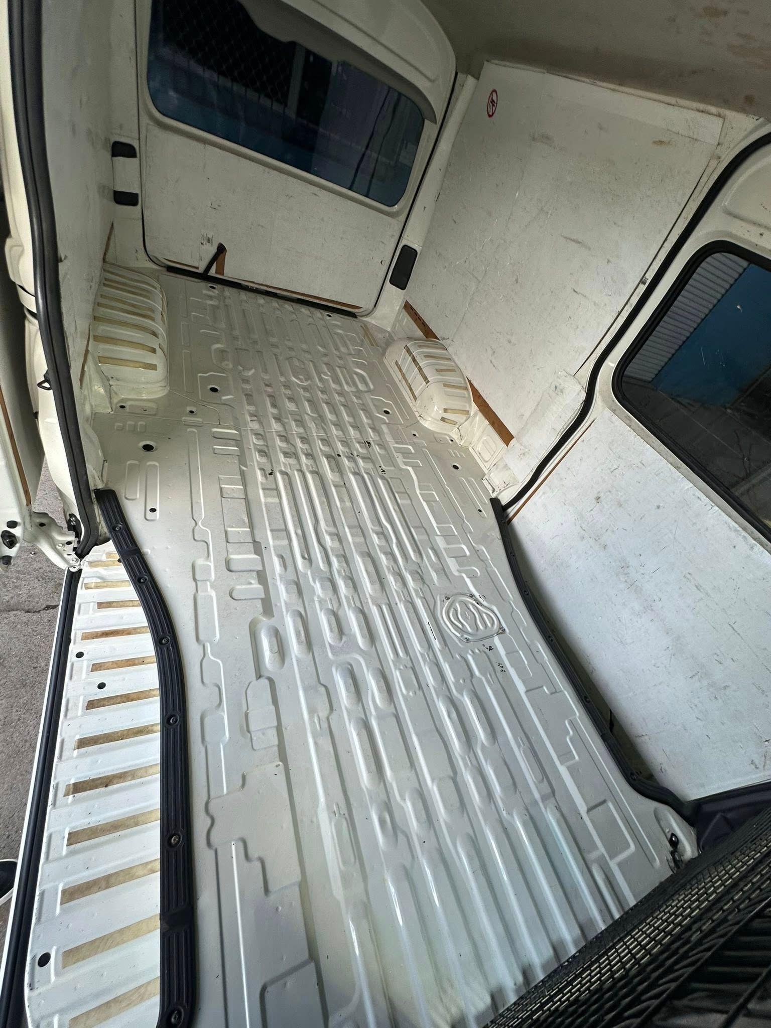 Empty, White-painted Cargo Area of a Van — Mobile Club Cars Cairns in Tully, QLD