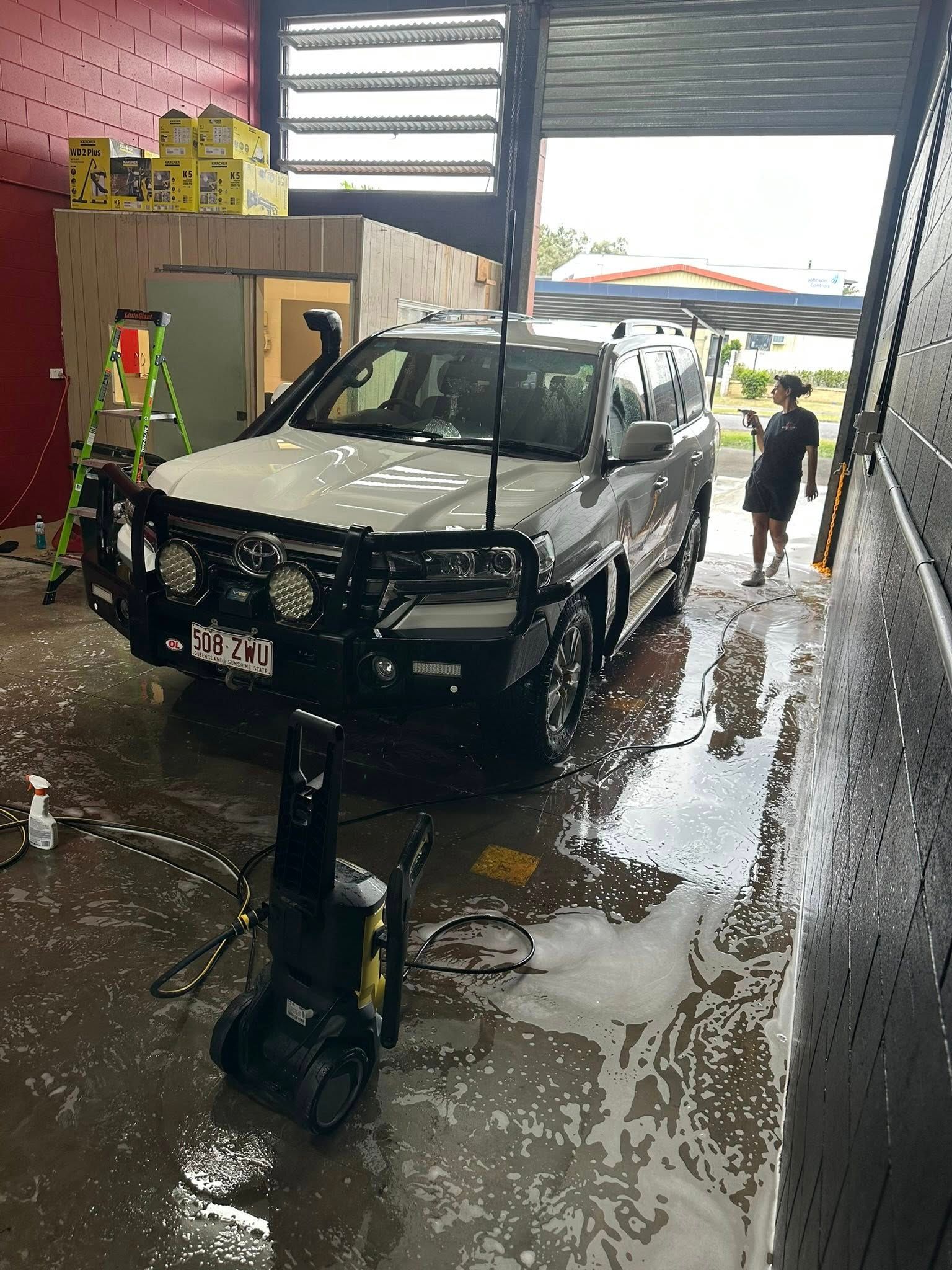 Open Back of a White Cargo Van; Interior With White Walls — Mobile Club Car Cleaning in Earlville, QLD