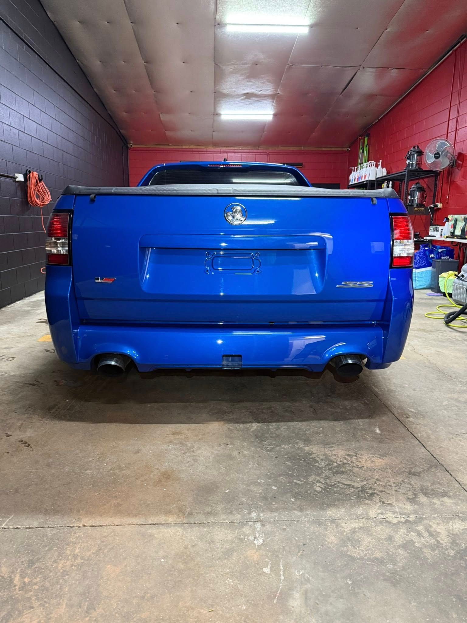 Blue Holden Ute Parked Inside a Garage — Mobile Club Car Cleaning in Earlville, QLD