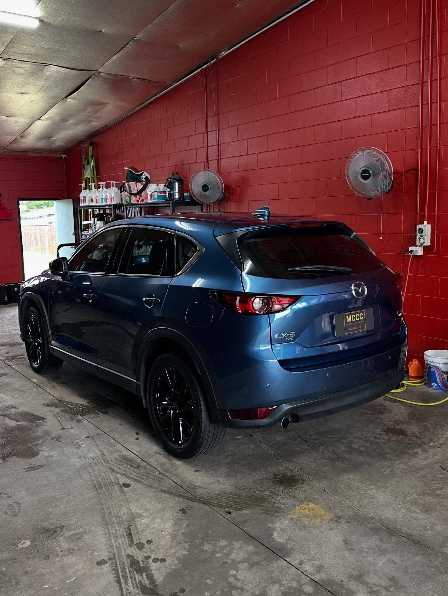 A Dark Blue Mazda Cx-5 Parked Inside a Workshop — Mobile Club Cars Cairns in Mission Beach, QLD